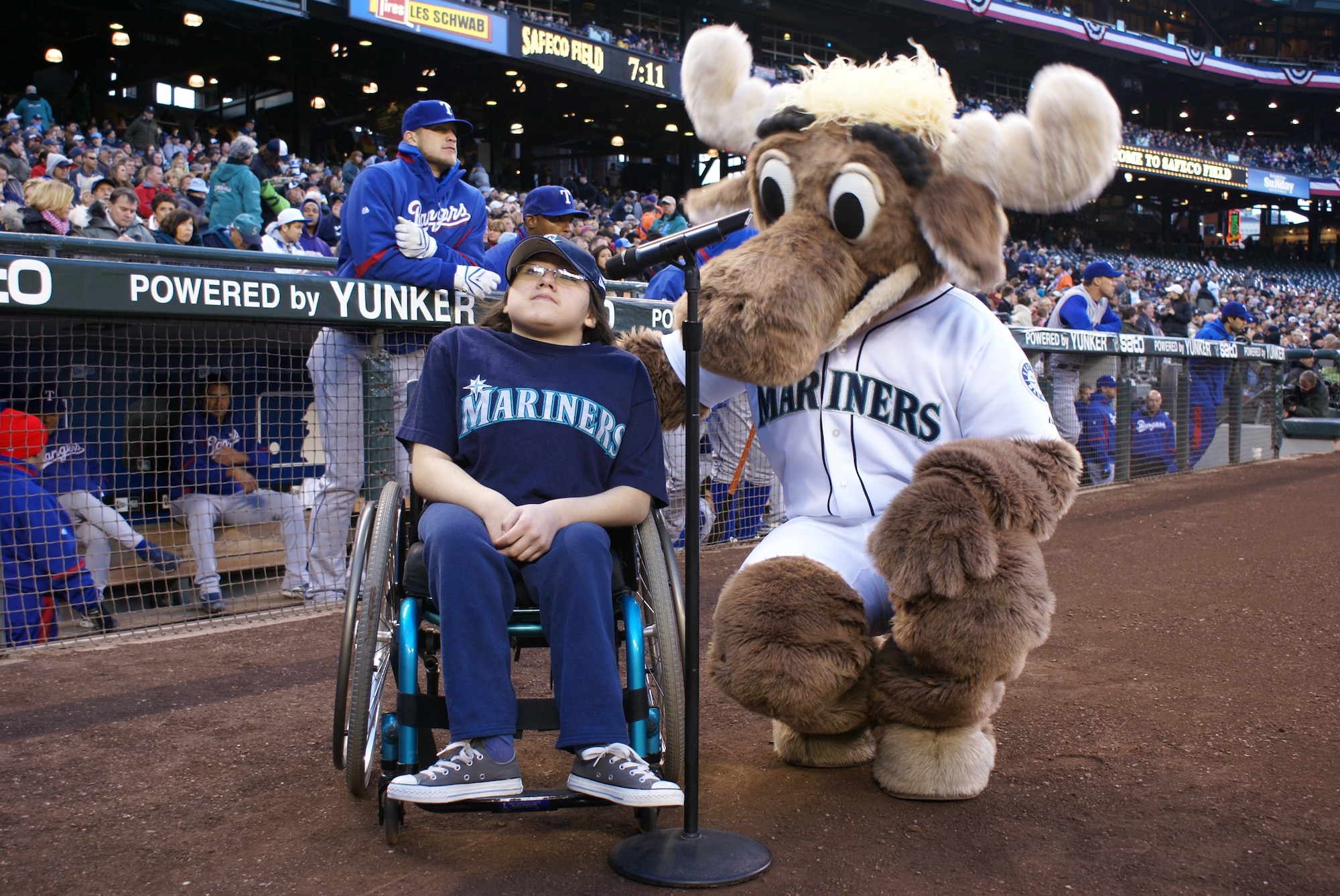 Fourteen-year-old Sammy Brooks prepares to make her pre-game announcement with the Mariner Moose before Tuesday’s game at Safeco Field against the Texas Rangers. Brooks, the daughter of a retired master sergeant in the 62nd Maintenance Squadron, joyfully shouted “Play ball!” to kick off the festivities on Military Appreciation Night. (U.S. Air Force photo/Airman 1st Class Kirsten Wicker)