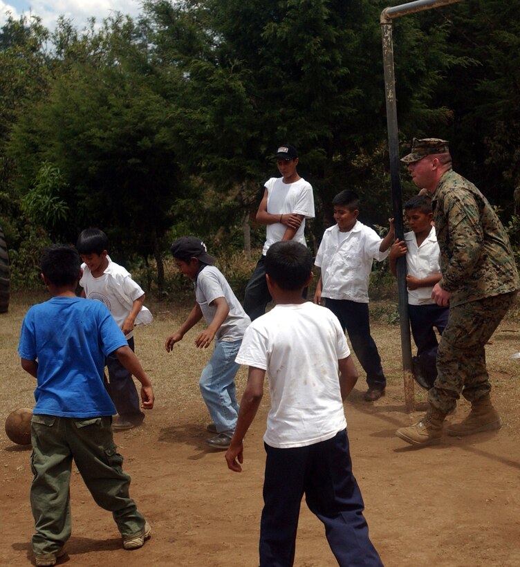 Lance Cpl. Adam P. Eisenmenger from delta company in Knoxville, Tenn., of the 4th Combat Engineer Battalion plays soccer with the children of Florida de Marcala during the opening ceremony of Beyond the Horizon.  BTH is a joint operation between the U.S. and Honduran militaries to provide medical services to Honduran citizens and complete construction projects.