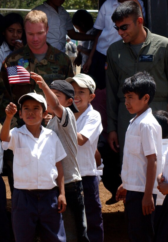 Local children display their support for the visiting country in Florida de Marcala, the site of the opening ceremony for Beyond the Horizon.  BTH is a joint endeavor between the U.S. and Honduran militaries to provide medical services to Honduran citizens and complete construction projects.  Soldiers from Honduras and the U.S. will build a a new two-room school, a bathroom and a water tower in Marcala.