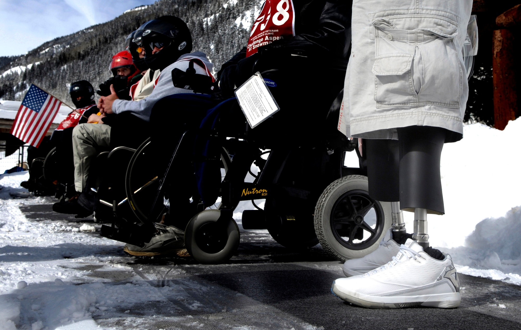 Several disabled veterans prepare to jump on snowmobiles during the 22nd National Disabled Veterans Winter Sports Clinic held at the Snowmass Village, Colo., April 2. Participation is open to service veterans with traumatic brain injuries, spinal cord injuries, orthopedic amputations, visual impairments, certain neurological problems and other disabilities.  The annual disabled learn-to-ski clinic helps motivate and rehabilitate disabled Department of Defense veterans. It is the largest of its kind in the world. The clinic instructs veterans on Alpine and Nordic skiing, rock climbing, snowmobiling, sled hockey, and more. (U.S. Air Force photo/Tech. Sgt. Cecilio Ricardo)
