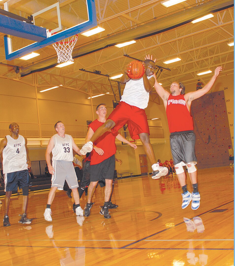 In a competitive tournament match, a member of AFPC #1 jumps over his competitors to retrieve a rebound to help take his team to tournament victory.