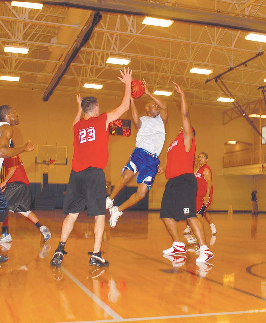 In a competitive tournament match, a member of AFPC #1 jumps over his competitors to retrieve a rebound to help take his team to tournament victory.
