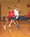 Chuck Freeman, #4, defends against his opponent from the 12th Medical Group during his drive to the hoop. The AFPC #1 team went on to win 59-47.