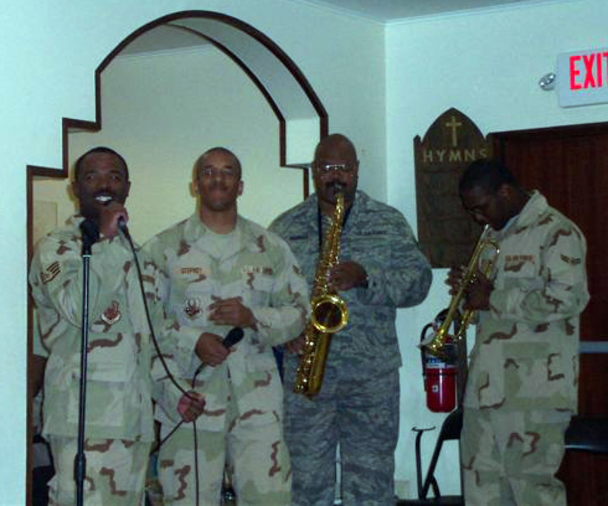 SEYMOUR JOHNSON AIR FORCE BASE, N.C. -- Tech. Sgt. Stewart Hawkins (second from the right), demonstrates his talents on the saxophone while deployed to Al Udeid, Qatar. Sergeant Hawkins is a power production journeyman with the 916th Civil Engineer Squadron. He volunteers during his off-time at his deployed location by helping the base chapel band.