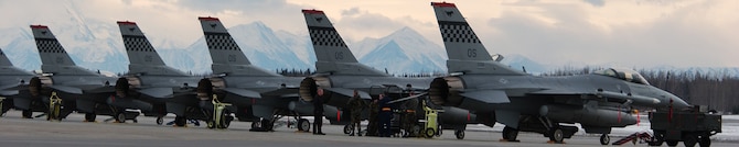 Ten F-16 fighting falcons sit on the tarmac late into the evening April 1 at Eielson Air Force Base, Alaska. Over the past few days aircraft have been gathering together for the up coming Red Flag-Alaska 08-2. These aircraft are assigned to the 36th Fighter Squadron, Osan Air base, Korea. (U.S. Air Force Photo/Airman 1st Class Jonathan Snyder)