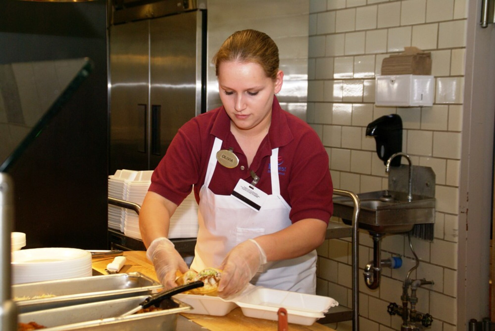 Olivia McCurry makes her “famous” wraps during wrap day in the A&E Cafeteria. (Photo by Philip Lorenz III)