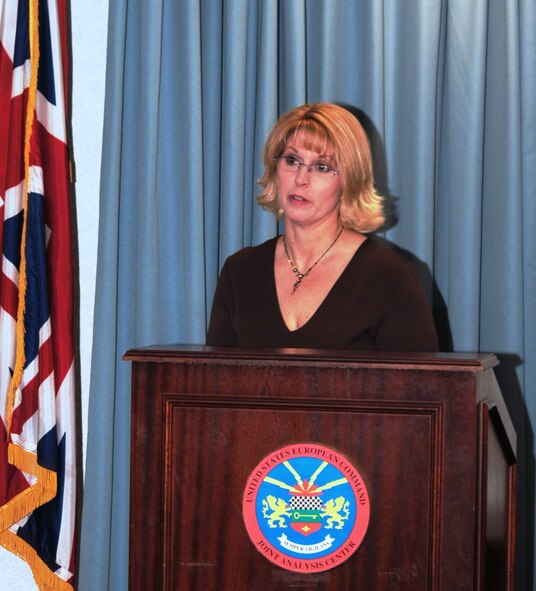Ms. Suzanne Wilson speaks at a ceremony at RAF Molesworth where the records of U.S. Army Air Corps airmen compiled by her father, former B17G pilot Lt. Col Edgar Miller were accepted by Col. Peter H. Devlin, JAC Commander.  (U.S. Air Force photo by Staff Sgt. Jocelyn L. Rich)