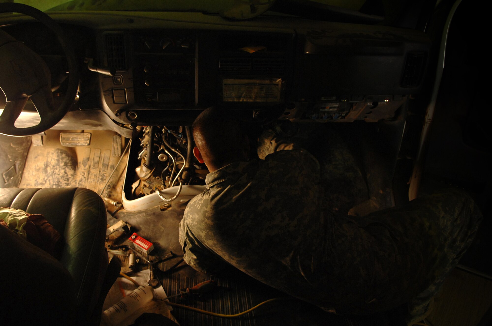 BALAD AIR BASE, Iraq -- Staff Sgt. Daniel Miranda, 332nd Logistics Readiness Squadron vehicle mechanic, replaces a cracked air intake manifold here, April 2. The 332 LRS mechanics repair all types of vehicles ranging from passenger buses to tactical vehicles. Sergeant Miranda is deployed from Nellis Air Force Base, Nev. (U.S. Air Force photo/ Senior Airman Julianne Showalter)
