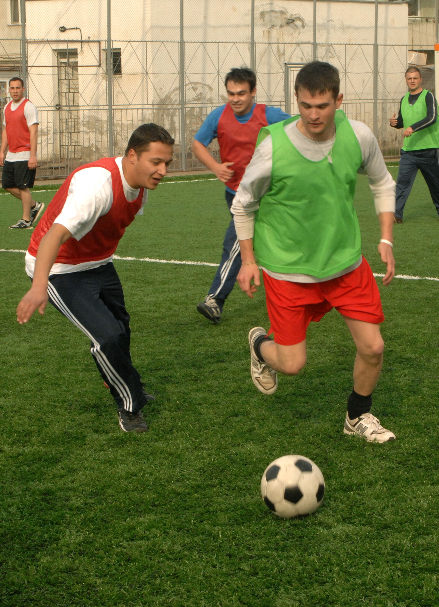 CAMPIA TURZII, Romania -- U.S. Air Force members enjoy a game of soccer with their Romanian counterparts after a day of work here March 29, 2008. The Airmen are deployed here as part of the U.S. military's support to the NATO Summit. The U.S. Air Force augmented NATO and Romanian forces, ensuring the security of the airspace above Bucharest.  (U.S. Air Force photo by Senior Airman Teresa M. Hawkins)