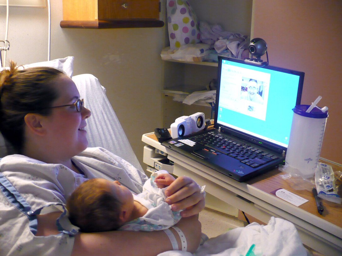 Staff Sgt. Nicholas Todd's wife, Jamie, talks to her husband via webcam just after their son, Rylan, was born via Cesarian section March 25.  Sergeant Todd is deployed to the 379th Expeditionary Maintenance Squadron from Ellsworth Air Force Base, S.D. (Courtesy photo)
