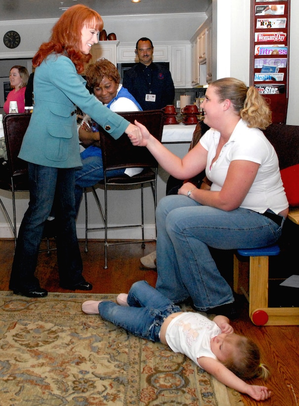 Comedienne Kathy Griffin greets Susan Badia at Walter Reed Army Medical Center's Fisher House III, April 3, 2008. Badia, her daughter, Kylee Ray, and her husband, U. S. Army Sgt. Jace Badia, are living next door to Fisher House II. Sgt. Badia is recuperating from wounds he sustained in Iraq from the blast of a homemade bomb. 