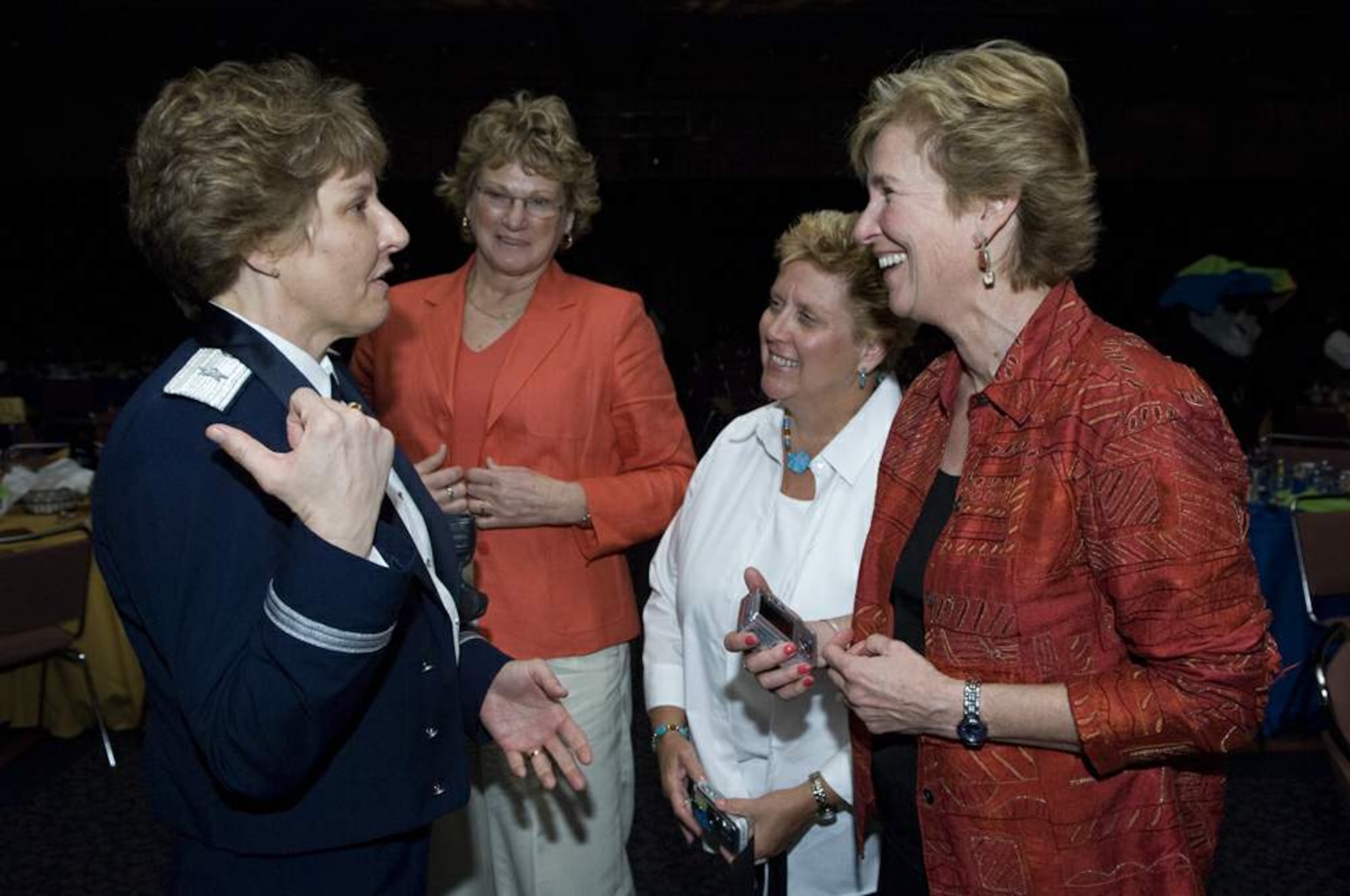 Brig. Gen. Michele D. Johnson speaks with 2008 Women's Final Four Salute dinner attendees and former Iowa State University basketball players (right to left) Connie Bauman, Darla Maldhauer and Donna Dalbella  April 4 in Tampa, Fla. General Johnson is the most decorated female athlete in U.S. Air Force Academy history. She was selected by the NCAA to speak to women athletes and participate at numerous NCAA events before the 2008 NCAA Women's Final Four basketball tournament. General Johnson is the deputy director on the war on terrorism, Strategic Plans and Policy Directorate on the Joint Staff at the Pentagon. (U.S. Air Force photo/Staff Sgt. Bennie J. Davis III)
