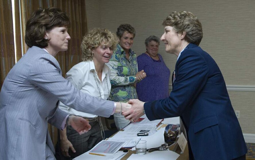 Brig. Gen. Michele D. Johnson greets members of the NCAA Women's Basketball Coaches Association Board of Directors meeting April 4 in Tampa, Fla. General Johnson is the most decorated female athlete in U.S. Air Force Academy history. She was selected by the NCAA to speak to women athletes and participate at numerous NCAA events before the 2008 NCAA Women's Final Four basketball tournament. General Johnson is the deputy director on the war on terrorism, Strategic Plans and Policy Directorate on the Joint Staff at the Pentagon. (U.S. Air Force photo/Staff Sgt. Bennie J. Davis III)