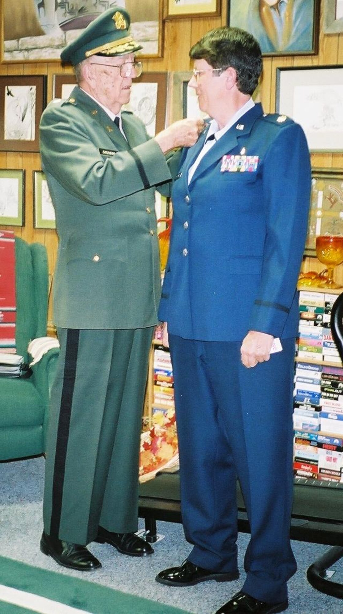 Retired Lt. Col. Otmar E. Stephens, Jr. pins his oak leaf clusters on daughter, Lt. Col. Maggie Stephens to commemorate her recent promotion.