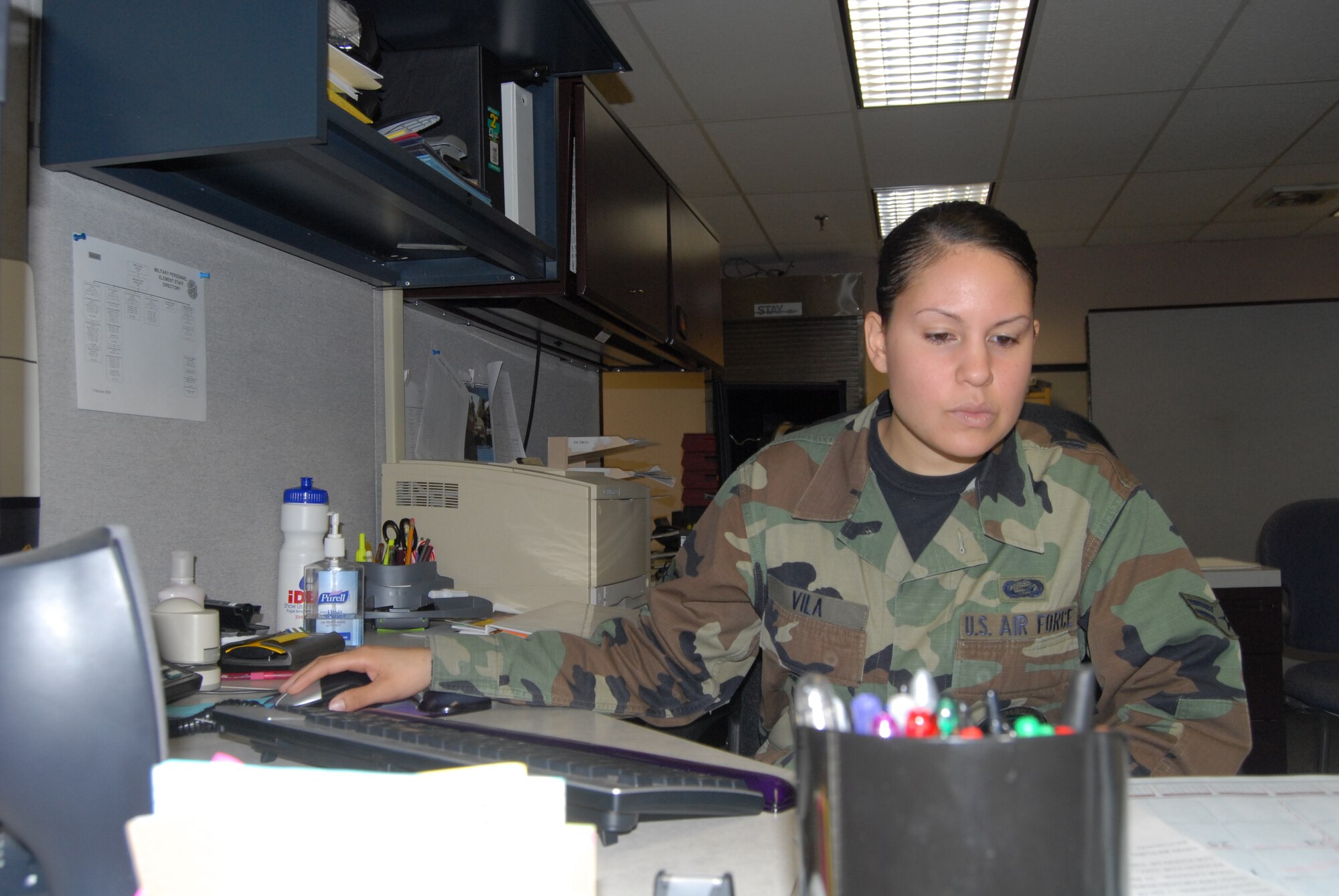 Airman 1st Class Ashleen Vila, 43rd Mission Support Squadron, updates temporary duty assignment information Tuesday.  (U.S. Air Force Photo by Airman 1st Class Mindy Bloem)