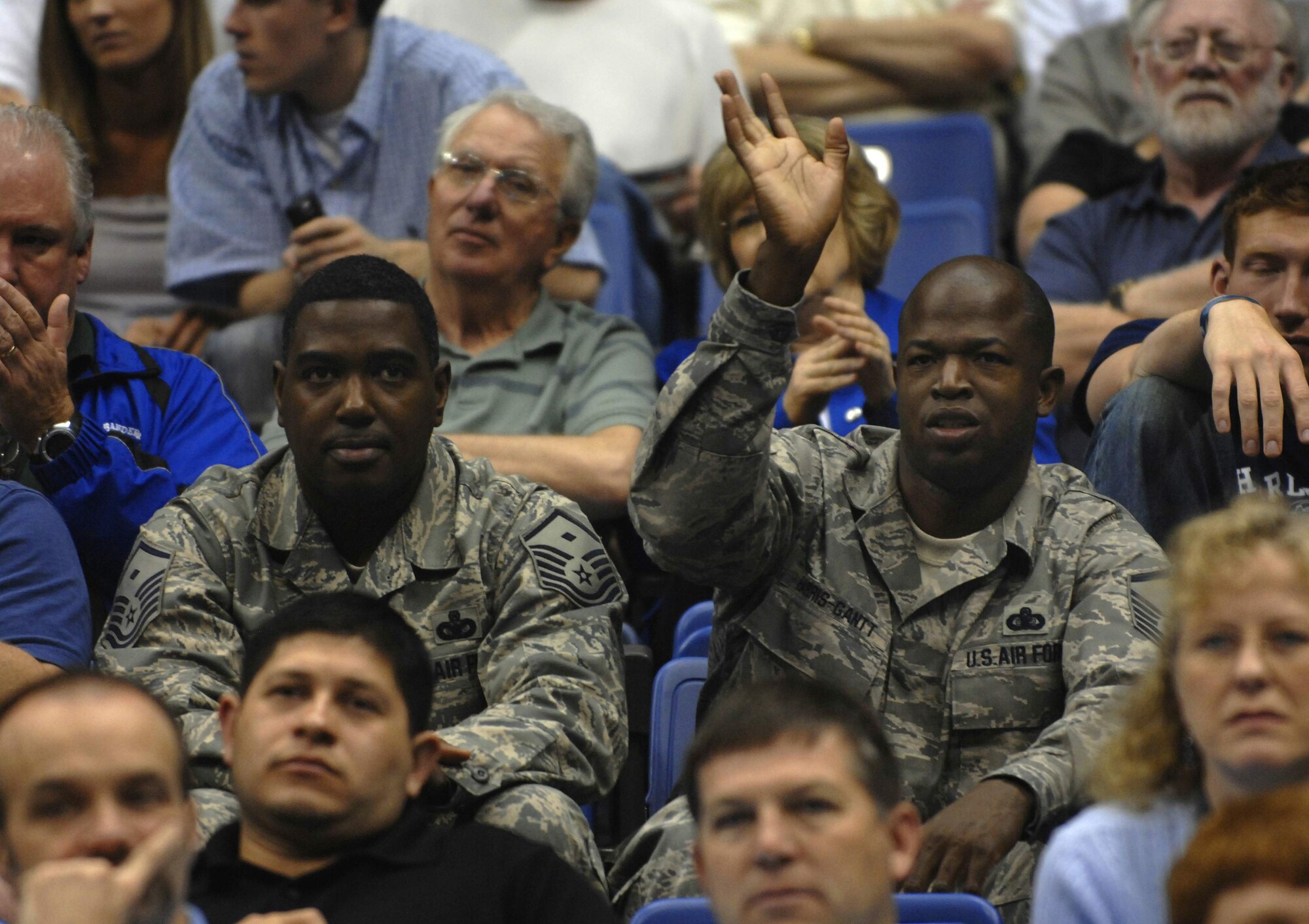 Master Sgts. Rodney McLeod and Joseph Harris-Gantt watch the University of Memphis basketball team practice April 4 at the Alamodome in San Antonio. The men's NCAA Final Four weekend brought the best college basketball teams to San Antonio for the national championship, and during the weekend NCAA officials honored American military members. Sergeant McLeod is the first sergeant of the 68th Information Operations Squadron from Brooks City-Base, Texas, and Sergeant Harris-Gantt is the chief of information management with the 68th IOS. (U.S. Air Force photo/Tech. Sgt. Larry Simmons)