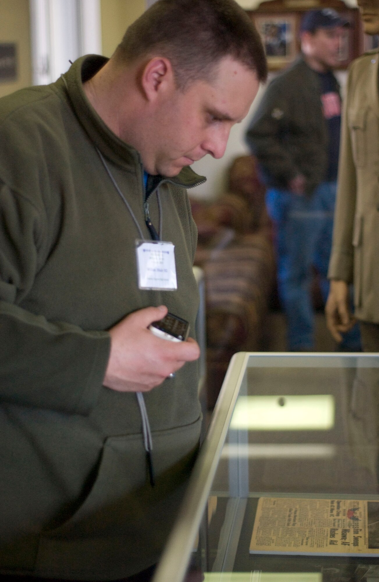 MISAWA AIR BASE, Japan -- William Blake from Tennessee looks at a display case in the Heritage Room at the 35th Fighter Wing headquarters on April 2, 2008. Mr. Blake is part of the Edgren High School Alumni Association that made the annual trip to visit their alma mater and home as military dependants. (U.S. Air Force photo by Senior Airman Samuel Morse)