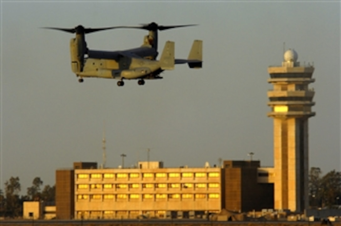 A MV-22 Osprey aircraft from the Marine Medium Tiltrotor Squadron 263 flies past the Baghdad International Airport air traffic control tower while approaching Sather Air Base, Iraq, March 16, 2008. Sather AB, located on the west side of Baghdad International Airport, is the largest passenger hub in Iraq. 