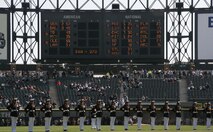Marines of the Silent Drill Platoon perform at the Chicago White Sox home opener April 7.