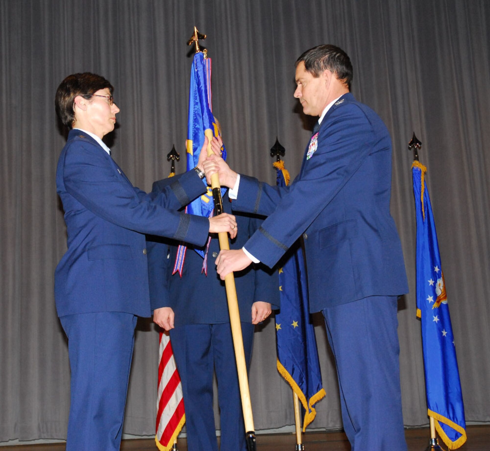 Col. John O. Griffin relinquishes command of the 168th Air Refueling Wing to Alaska Air National Guard Commander Brig. Gen. Deborah McManus April 5 at the base theater.  Griffin was commander of the Alaska Air National Guard?s 168th Air Refueling Wing since August 2006. (U.S. Air Force photo by Capt. Guy Hayes, DMVA Public Affairs)