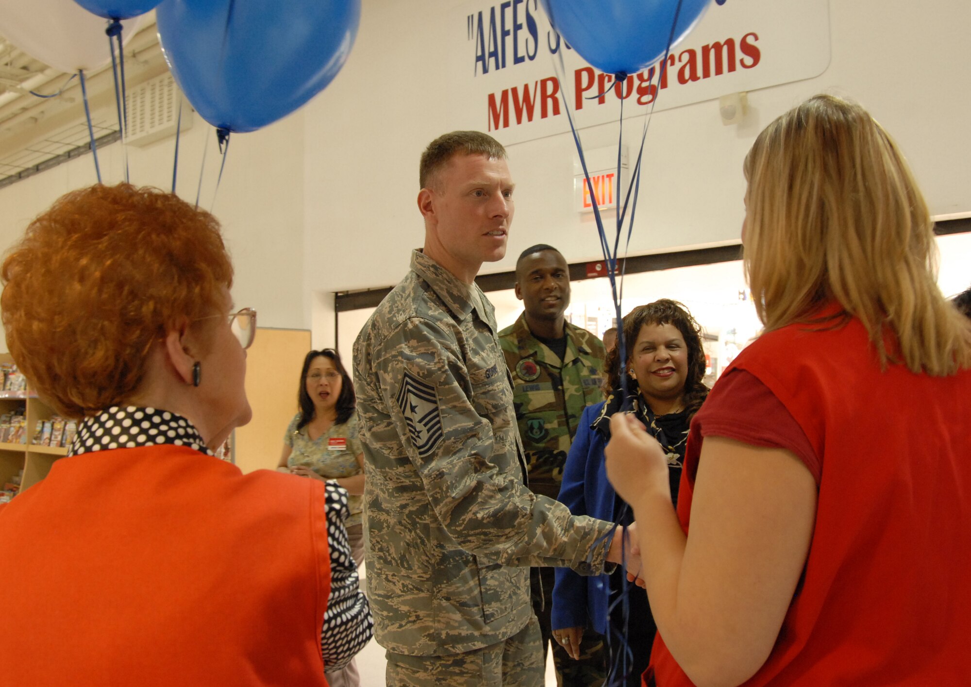 Chief Master Sgt. William Gurney, Air Force Materiel Command command chief, greets employees from the Base Exchange during a recent visit to Edwards. Chief Gurney received a tour of the Base Exchange and Commissary before being the guest speaker at the Team Edwards Chief Master Sergeant Recognition Ceremony on April 4. (Air Force photo by Senior Airman Stacy Sanchez)