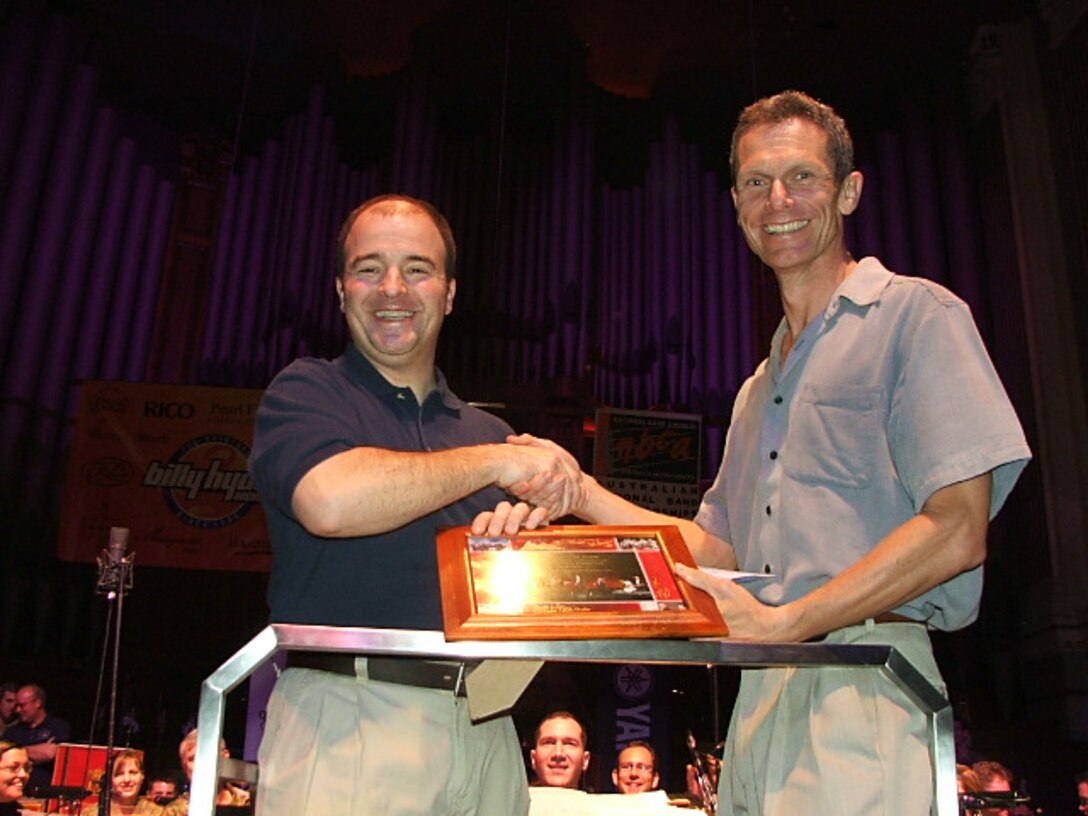 Major Henry, USAF Band of the Pacific, presents a plaque to Major Thomas, Army Band, Brisbane, Australia, from Alaska Brass in appreciation for the hospitality of the Army Band and everyone involved in the Brisbane National Band Festival 2008.