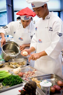 Staff Sgt. Jocelyn Ferber and Airman 1st Class Jeffery Juan, both 62nd SVS, demonstrate teamwork by sharing duties during the early stages of the competition.(U.S. Air Force photo/Abner Guzman)