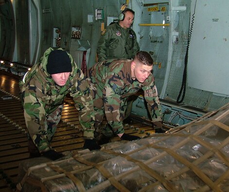 GALAXY  LOAD -- Staff Sgts. Glenn W. McAvoy and Anthony D. Marlak, 42nd Aerial Port Squadron, practice loading cargo aboard a C-5 Galaxy during the April A UTA at Westover Air Reserve Base, Mass.  (US Air Force photo/Master Sgt. W.C. Pope)