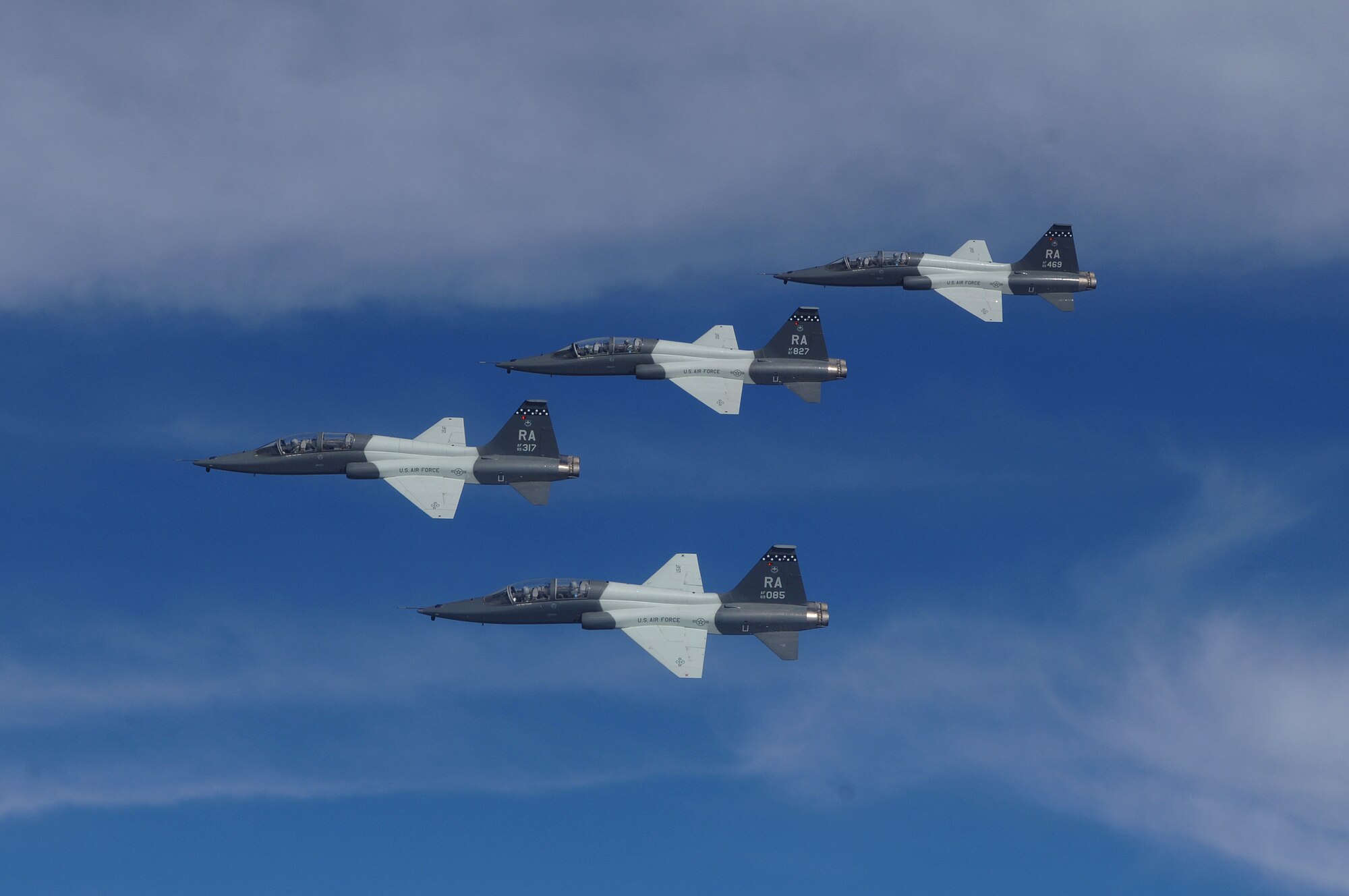 A flight of four T-38s from the 560th Flying Training Squadron, 12th Flying Training Wing, Randolph AFB, Texas fly in formation over Texas, March 27, 2008. Three retired Air Force pilots, who were POWs in Vietnam, flew back seat during the mission as part of Randolph's POW Ceremonies. US Air Force Photo by Master Sgt. Scott Reed