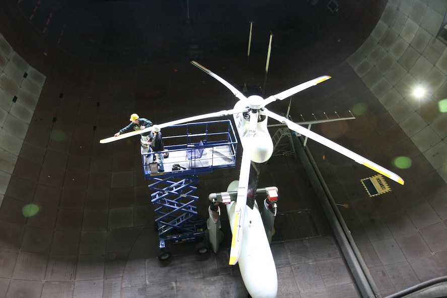 From left, Chris Barkley, Boeing’s lead mechanic on the test and Oscar Joson, NFAC wind tunnel mechanic, conduct a pre-flight blade inspection. (Photo by Jeff Johnson)