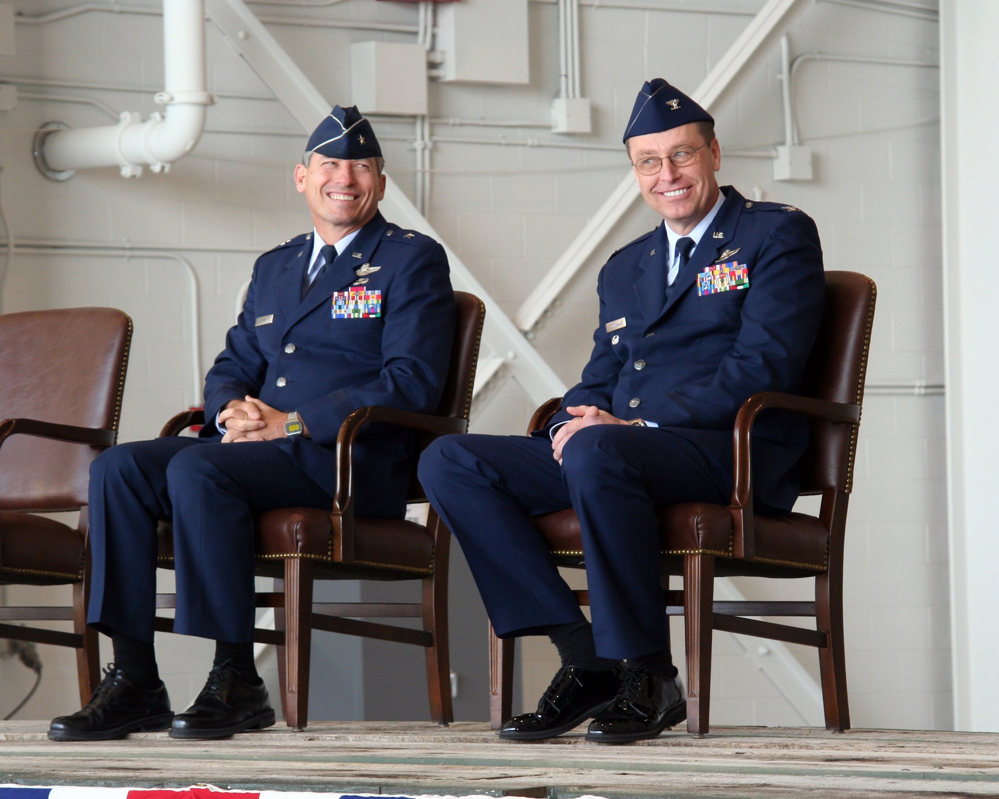 WRIGHT-PATTERSON AFB, Ohio - Retiring Brig. Gen Bruce Davis and incoming Commander Col. Stephen Goeman share a laugh during the 445th Airlift Wing Change of Command Ceremony April 6, 2008.  The wing said goodbye to Brig. Gen Bruce E. Davis as he relinquished command and welcomed the incoming commander, Col. Stephen D. Goeman. The ceremony took place in the wings new Fuel System Maintenance Hangar with a massive C-5 as the backdrop. (U.S. Air Force photo/Maj. Jose Cardenas)