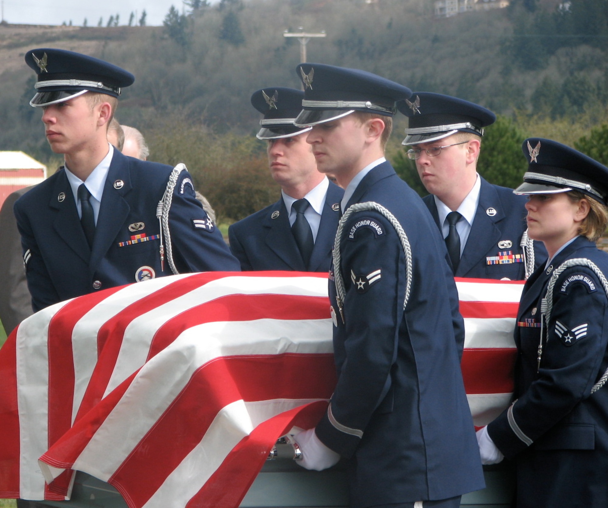 McChord Honor Guard Airmen carry Doolittle Raider Jacob DeShazer’s casket to his
burial site during a ceremony March 29 in Salem, Ore. (U.S. Air Force photo/Heather Lewis)