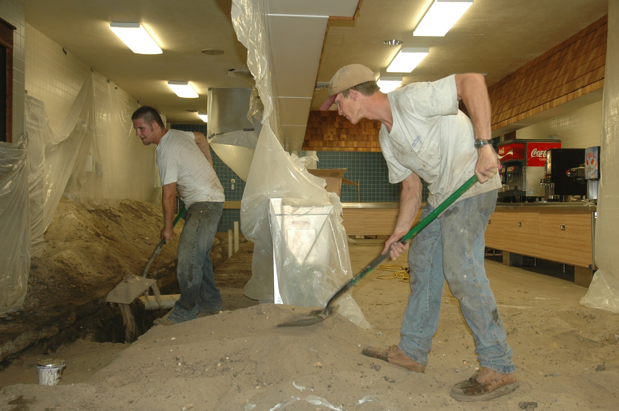 Contractors work to repair the plumbing system in the Berg-Liles Dining Facility, which is slated to reopen for service April 23. 