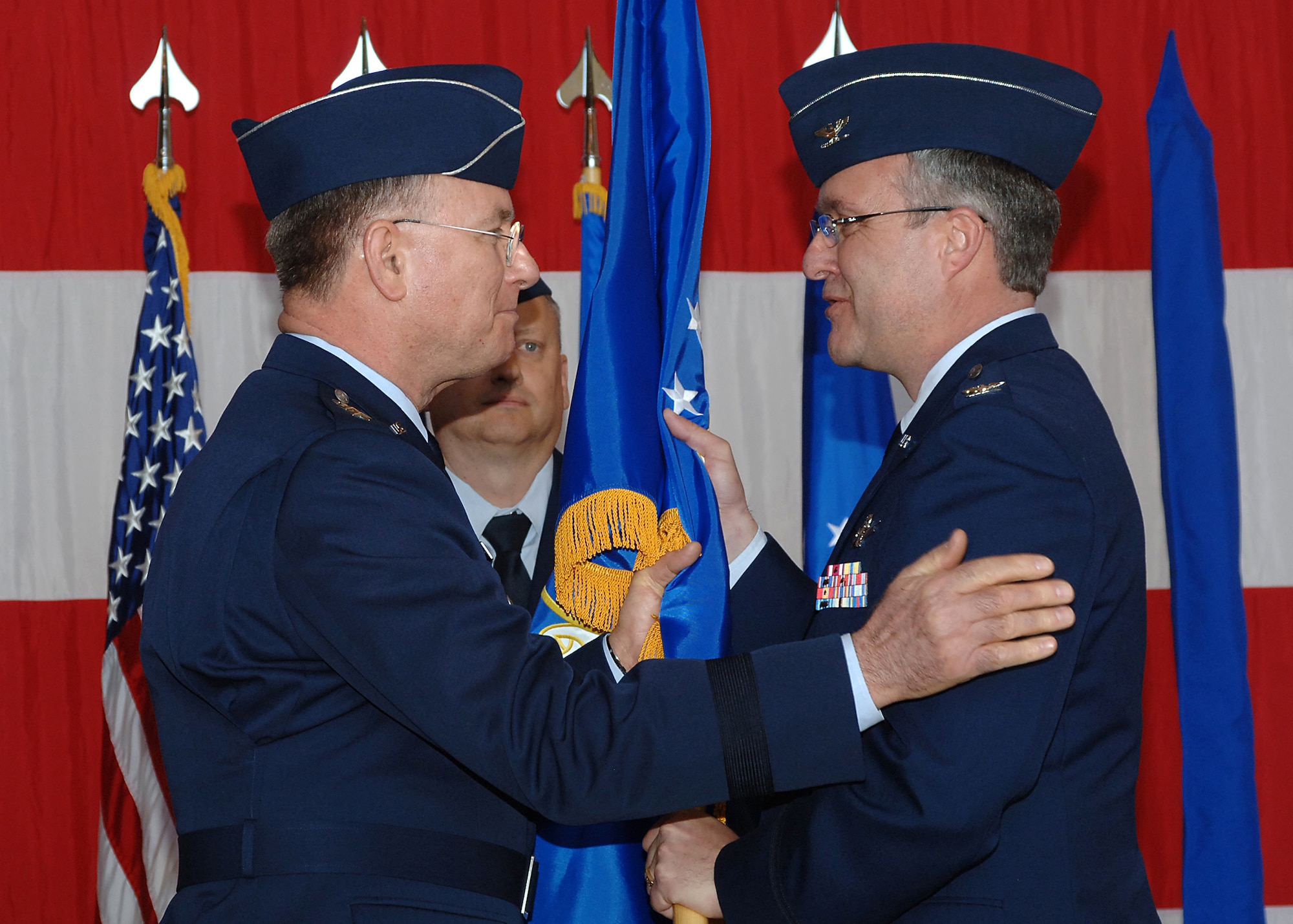 Lt. Gen. John Bradley, left, chief of Air Force Reserve and commander of Air Force Reserve Command, hands the 310th Space Wing colors and command of the Air Force Reserve's first-ever space wing, to Col. Jeff Ansted April 4.  Colonel Ansted took command of the 310th at a ceremony at Peterson Air Force Base, Colo. 

The 310th provides its gaining major command, Air Force Space Command, with experienced people in seven space squadrons to man space-based systems including Defense Meteorological satellites for weather observation, Midcourse Space Experiment satellite to conduct space surveillance, the Space-Based Infrared System for early missile warning and Global Positioning System satellites used for navigation.  

The wing also includes a test squadron, several base support squadrons, medical staff and the Reserve National Security Space Institute.  In all, ten squadrons, five stand-alone flights and the institute report to the 310th SW.

(U.S. Air Force Photo/Amber K. Whittington)