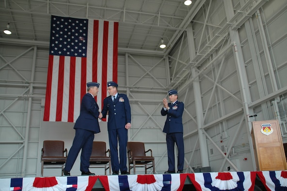 WRIGHT-PATTERSON AFB, Ohio - Maj. Gen. Robert Duignan, 4th Air Force commander, shakes hands to congratulate incoming 445th Airlift Wing Commander Col. Stephen D. Goeman as Brig. Gen. Bruce E. Davis (right) looks on.  Gen. Duignan officated the 445th Airlift Wing's Change of Command Ceremony April 6, 2008.  The ceremony took place in the wings new Fuel System Maintenance Hangar. (U.S. Air Force photo/Tech. Sgt. Charlie Miller)
