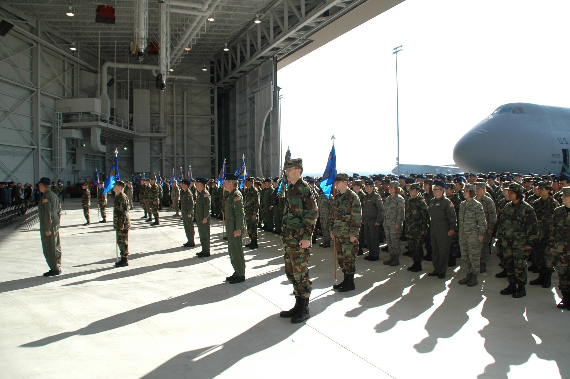 WRIGHT-PATTERSON AFB, Ohio - Members of the 445th Airlift Wing stand in formation during the wing's Change of Command Ceremony April 6, 2008.  The wing said goodbye to Brig. Gen Bruce E. Davis as he relinquished command and welcomed the incoming commander, Col. Stephen D. Goeman.  The ceremony took place in the wings new Fuel System Maintenance Hangar with a massive C-5 as the backdrop. (U.S. Air Force photo/Tech. Sgt. Charlie Miller)