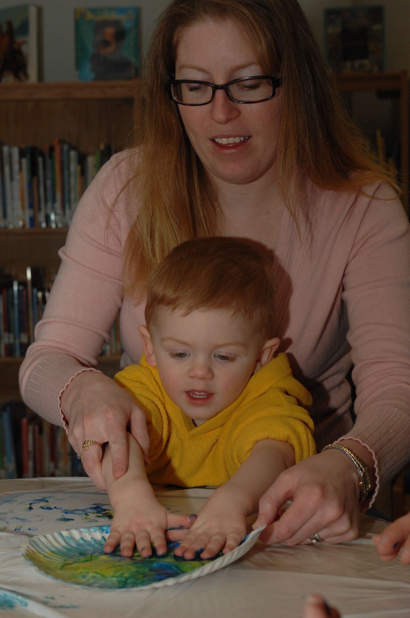 SPANGDAHLEM AIR BASE, Germany -- Katie and William VanderZanden, 2, father is Staff Sgt. Nathan VanderZanden, 52nd Equipment Maintenance Squadron, finger paint during Children's Reading Hour held at the Spangdahlem AB Library, April 3rd, 2008. (U.S. Air Force photo/Staff Sgt. Kristin Ruleau) 