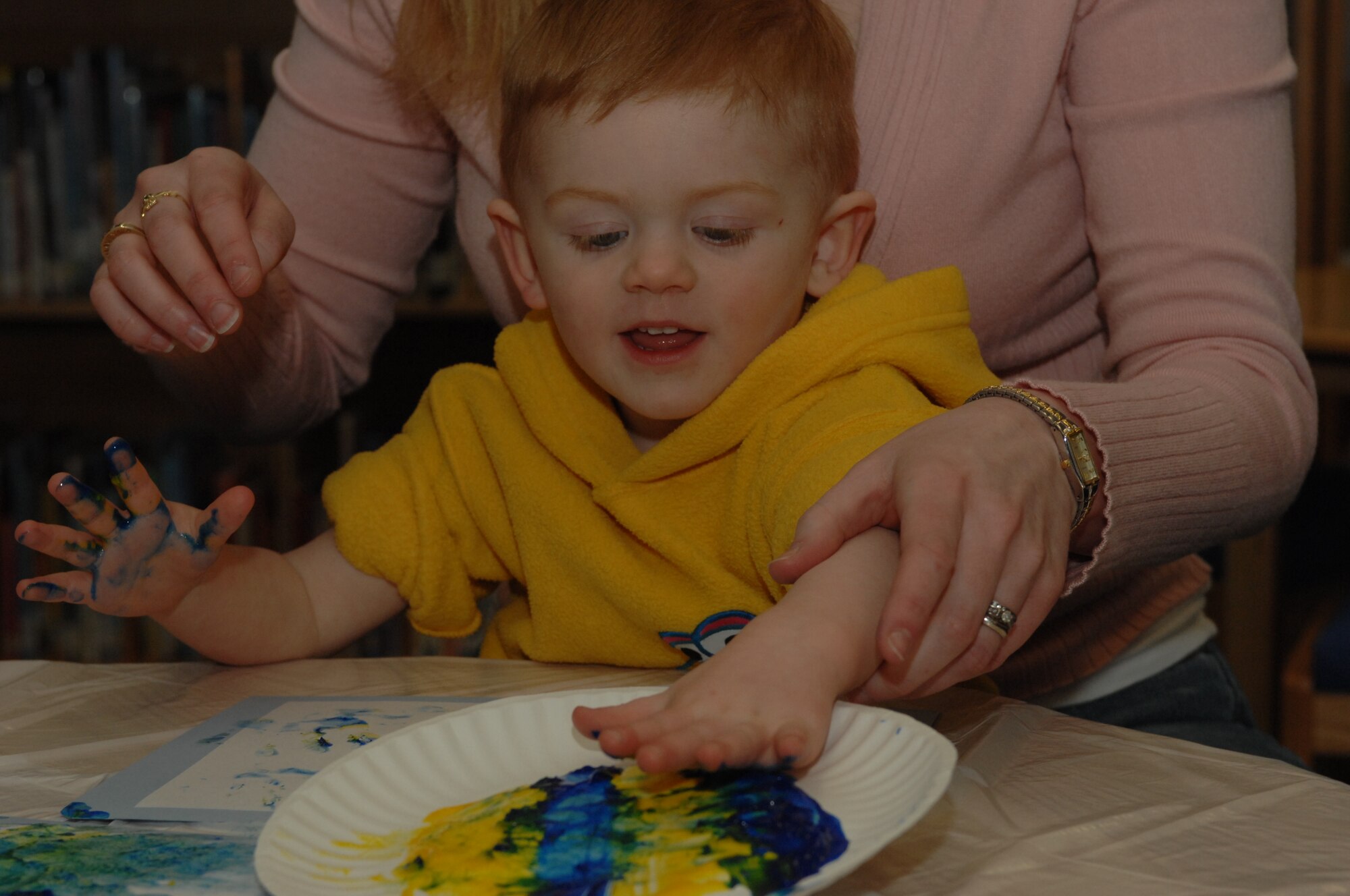 SPANGDAHLEM AIR BASE, Germany -- William VanderZanden, 2, son of Katie and Staff Sgt. Nathan VanderZanden, 52nd Equipment Maintenance Squadron, finger paints during Children's Reading Hour held at the Spangdahlem AB Library, April 3rd, 2008. (U.S. Air Force photo/Staff Sgt. Kristin Ruleau) 