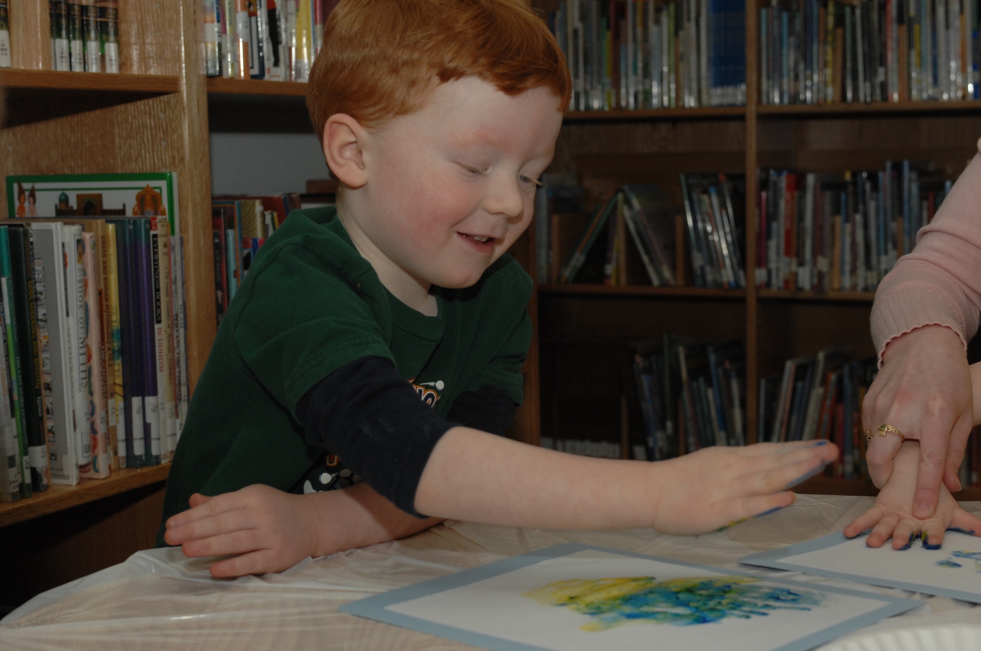SPANGDAHLEM AIR BASE, Germany -- Daniel VanderZanden, 4, son of Katie and Staff Sgt. Nathan VanderZanden, 52nd Equipment Maintenance Squadron, finger paints during Children's Reading Hour held at the Spangdahlem AB Library, April 3rd, 2008. (U.S. Air Force photo/Staff Sgt. Kristin Ruleau) 