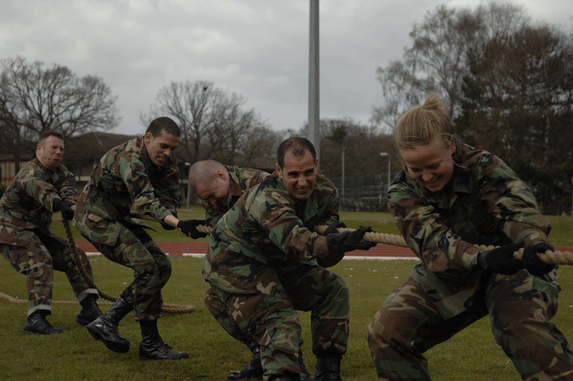 The 48th Component Maintenance Squadron team, Senior Master Sgt. Jeffrey Jacobson, Airman 1st Class Steven Brooks, Staff Sgt. Kyler Aebischer, Maj. Tony Lombardo and 1st Lt. Kelly Collier work together to defeat four teams in a match of tug-of-war during the warrior games sponsored by 48th Services Squadron, April 1, RAF Lakenheath, England. (U.S. Air Force photo by Airman 1st Class Erika Brooke)
