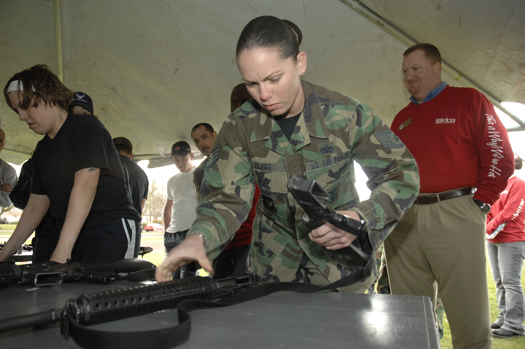 Staff Sgt. Jessica Clegg, 48th Security Forces Squadron, assembles an M-16 to help her team during the warrior games sponsored by 48th Services Squadron, April 1, RAF Lakenheath, England. (U.S. Air Force photo by Airman 1st Class Erika Brooke)
