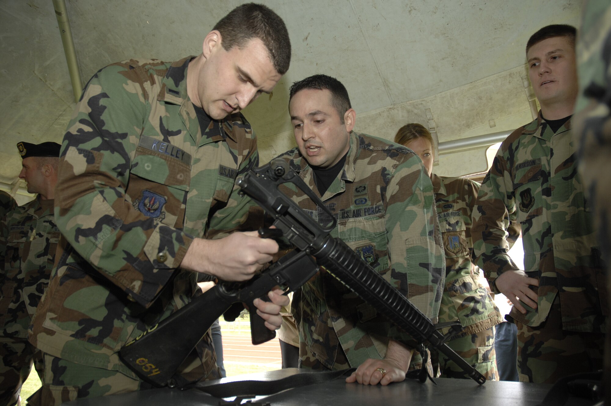 1st Lt. Richard Kelley and Tech. Sgt. Anthony Meadows, 48th Communications Squadron work together to assemble an M-16 during the warrior games sponsored by 48th Services Squadron, April 1, RAF Lakenheath, England. (U.S. Air Force photo by Airman 1st Class Erika Brooke)