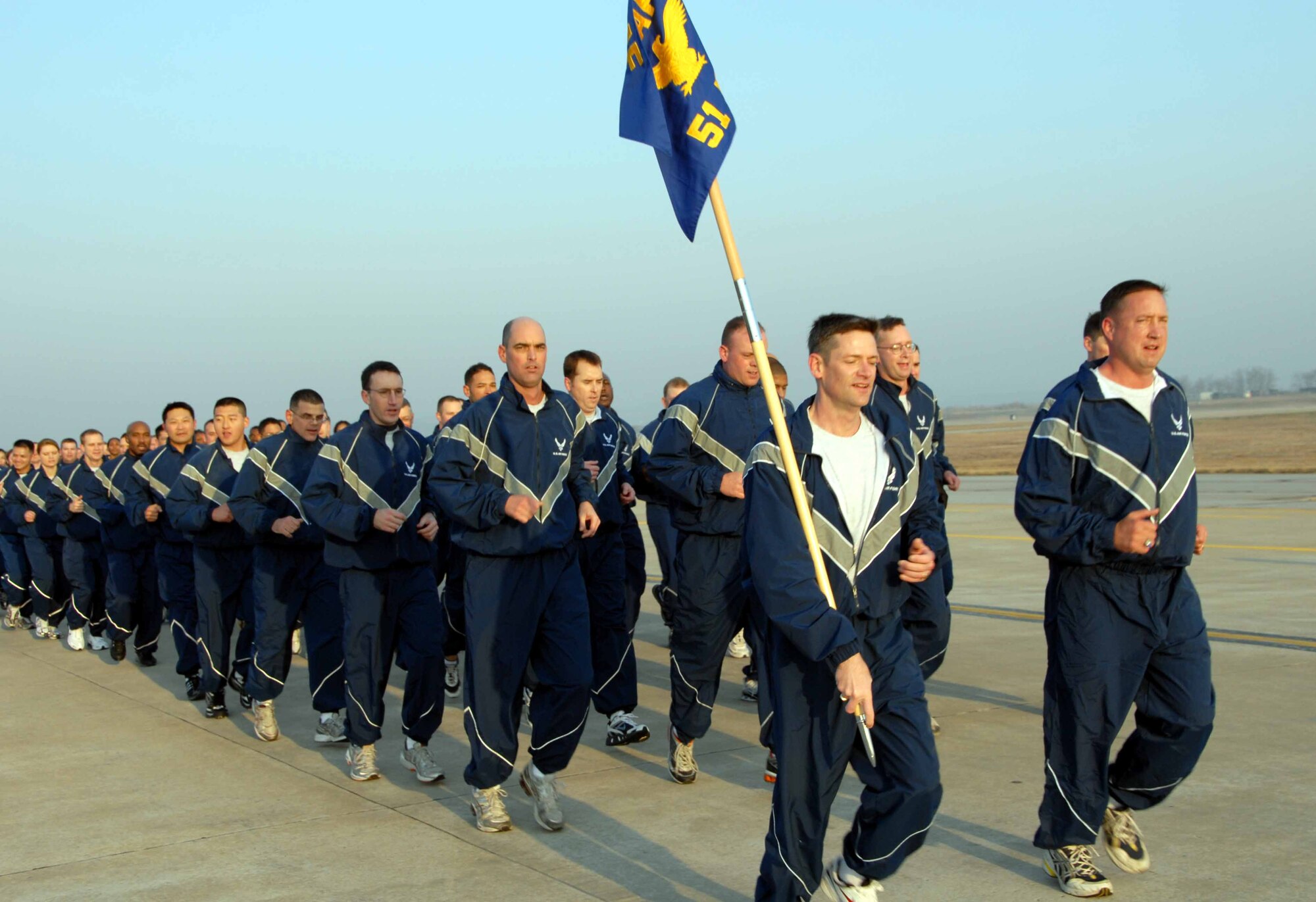 OSAN AIR BASE, Republic of Korea -- Members of the 51st Fighter Wing, led by Col. Jon Norman, (far right), 51st FW commander, enjoy an early morning jog around the flightline during the Air Power run April 4. (U.S. Air Force photo/Staff Sgt. Lakisha Croley)