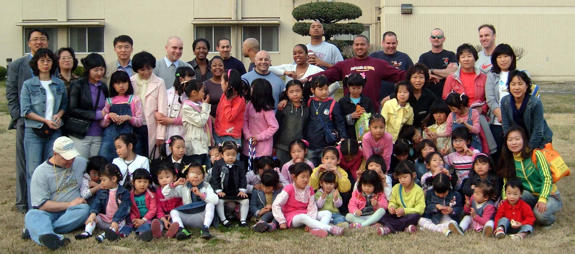 Gwangju Air Base, Republic of Korea -- Members from the 607th Material Maintenance Squadron, Detachment 1 pose with children and staff members from the Song-Bin-Yo-Sa orphanage during an Easter party April 4. (U.S. Air Force photo/Pak, Ki Hyon)