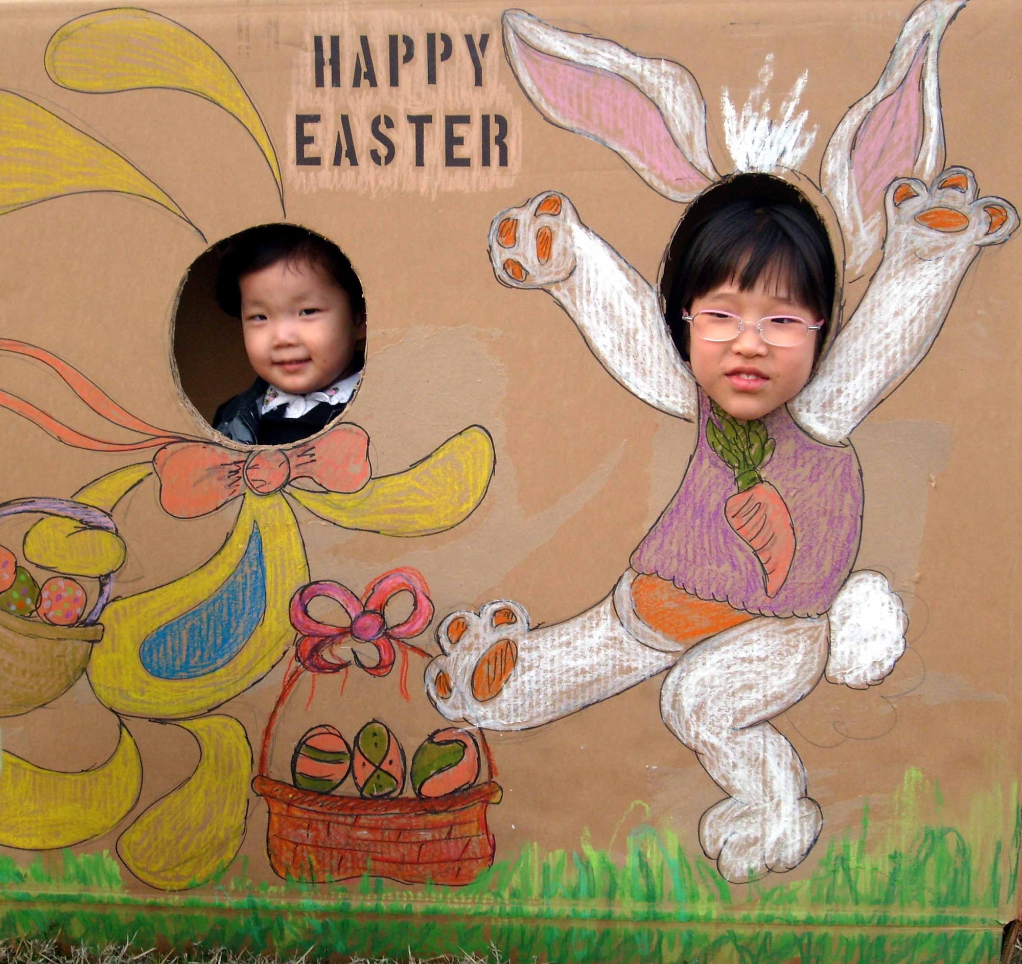 Gwangju Air Base, Republic of Korea -- Two children from the Song-Bin-Yo-Sa orphanage pose as Easter bunnies during the 607th Material Maintenance Squadron, Detachment 1 Easter party April 4. (U.S. Air Force photo/Pak, Ki Hyon)