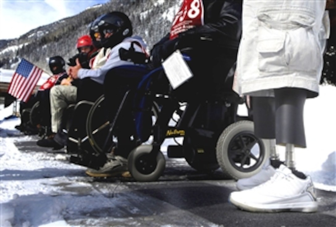 Disabled veterans prepare to board snowmobiles during the 22nd National Disabled Veterans Winter Sports Clinic, Snowmass Village, Colo., April 2, 2008. 