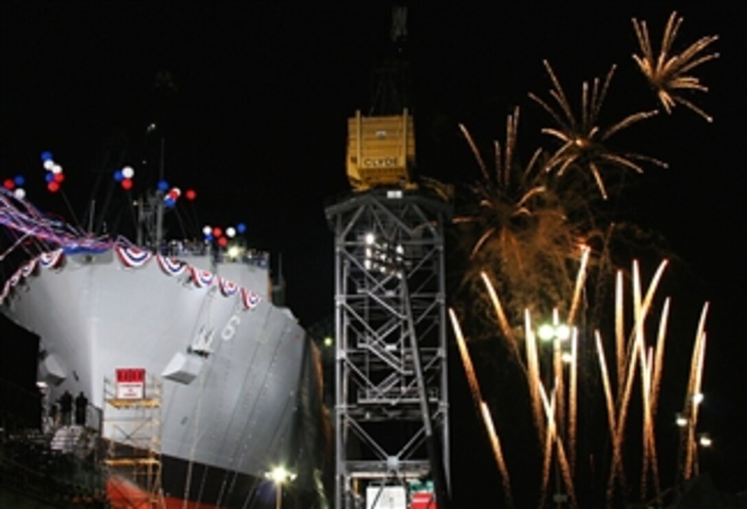 Fireworks detonate as the USNS Amelia Earhart is christened during a nighttime ceremony at the General Dynamics NASSCO shipyard in San Diego, April 6, 2008. The ship is named after the aviation pioneer who in 1932 became the first woman to fly alone across the Atlantic. 