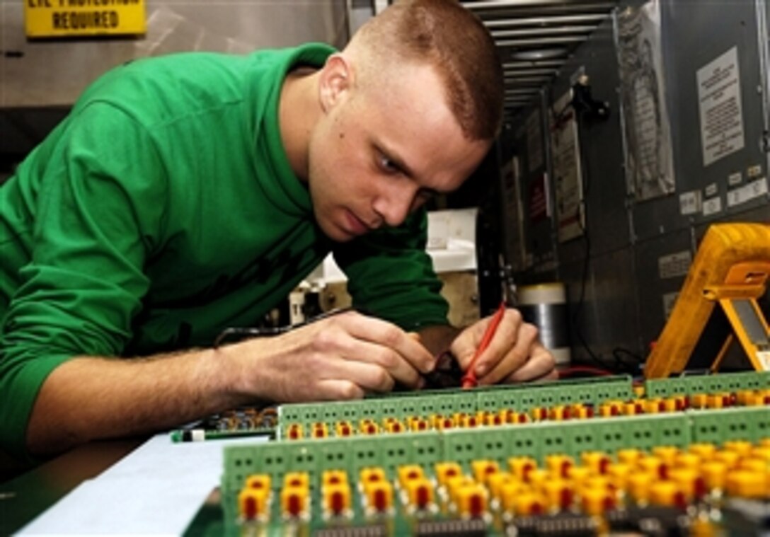 U.S. Navy Petty Officer 3rd Class Joshua Savage troubleshoots a generator test board, March 22, 2008, in the avionics shop aboard the nuclear-powered aircraft carrier USS Nimitz. The Nimitz is under way in the Pacific Ocean. 