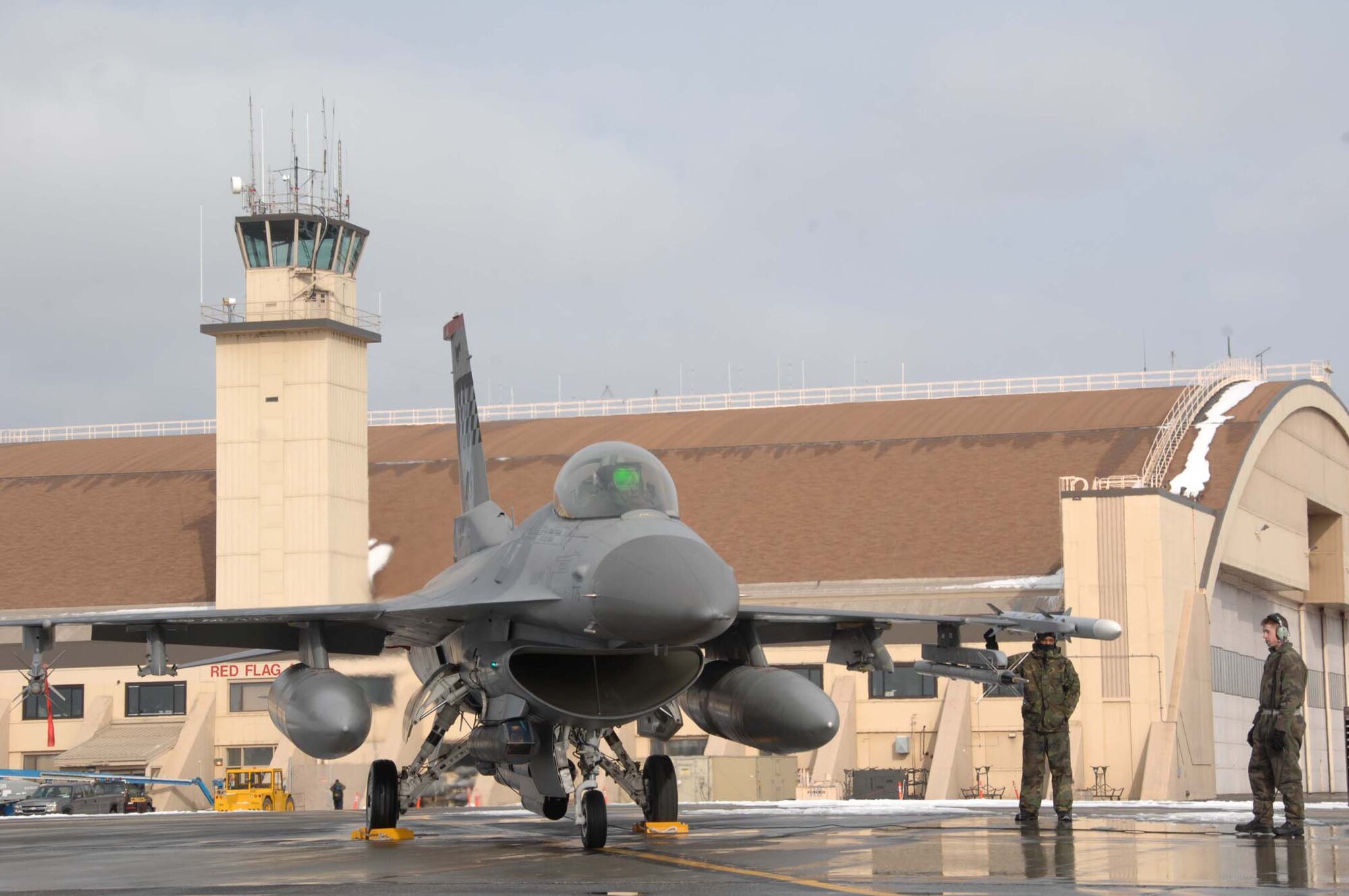 EIELSON AFB, Alaska -- Osan crew chiefs perform a pre-flight inspection on an F-16 Fighting Falcon during Red Flag-Alaska 08-2 April 8 here.  Each RED FLAG-Alaska exercise is a multi-service, multi-platform coordinated, combat operations exercise and corresponds to the designed operational capability of participating units. (U.S. Air Force photo/Staff Sgt. Tia Schroeder) 
