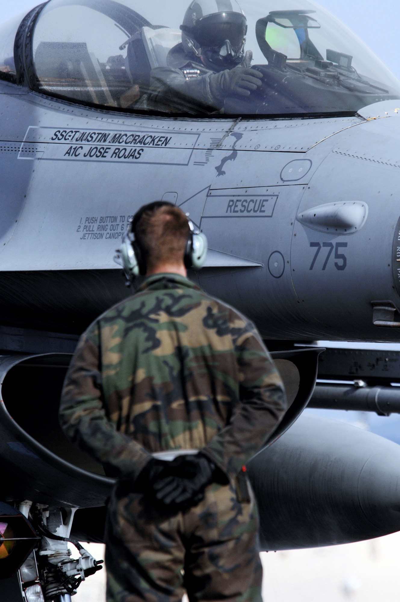 F-16 Fighting Falcon pilot U.S Air Force Captain Patrick Lysaght from the 36th Fighter Squadron, Osan Air Base, Republic of Korea provides a hand gesture from the cockpit to Airman 1st Class Jeffery Jones, a crew chief also form Osan Air Base signaling that he is prepared to marshaled out onto the flight line too start the training sortie over the Pacific Alaska Range Complex on April 7, 2008. RED FLAG-Alaska is a series of Pacific Air Forces field training exercises for U.S Forces and allies that provide joint offensive counter-air, indirection, close air support, and large force employment training in a simulated combat environment.

(U.S Air Force Photo by Technical Sgt. Eric T. Sheler)
